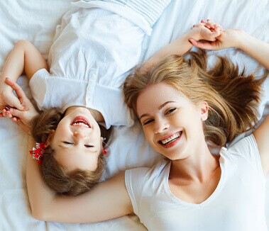 Mom & Daughter Smiling in Happiness